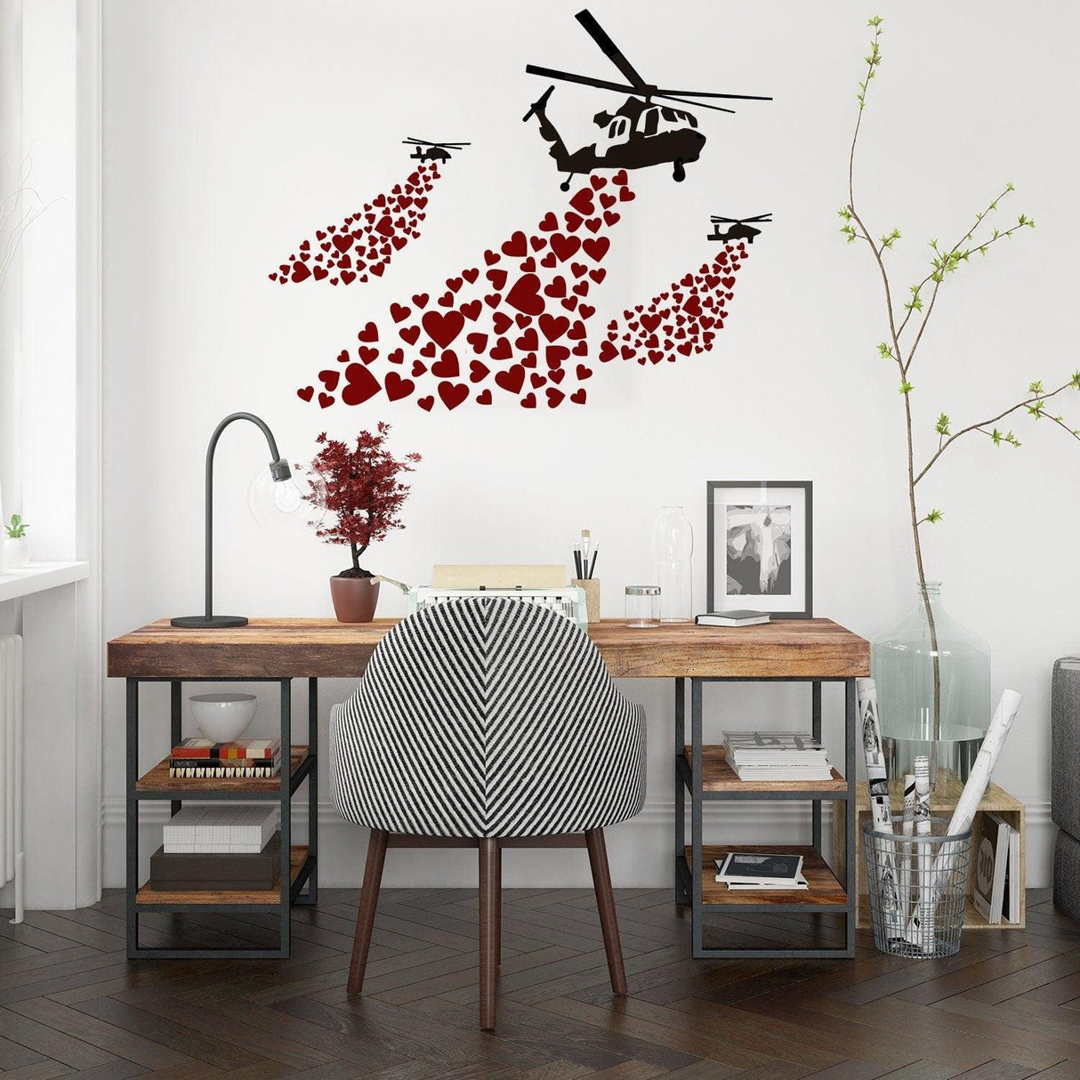 Banksy vinyl wall decal of a helicopter releasing hearts, adding stylish street art decor to a modern workspace.