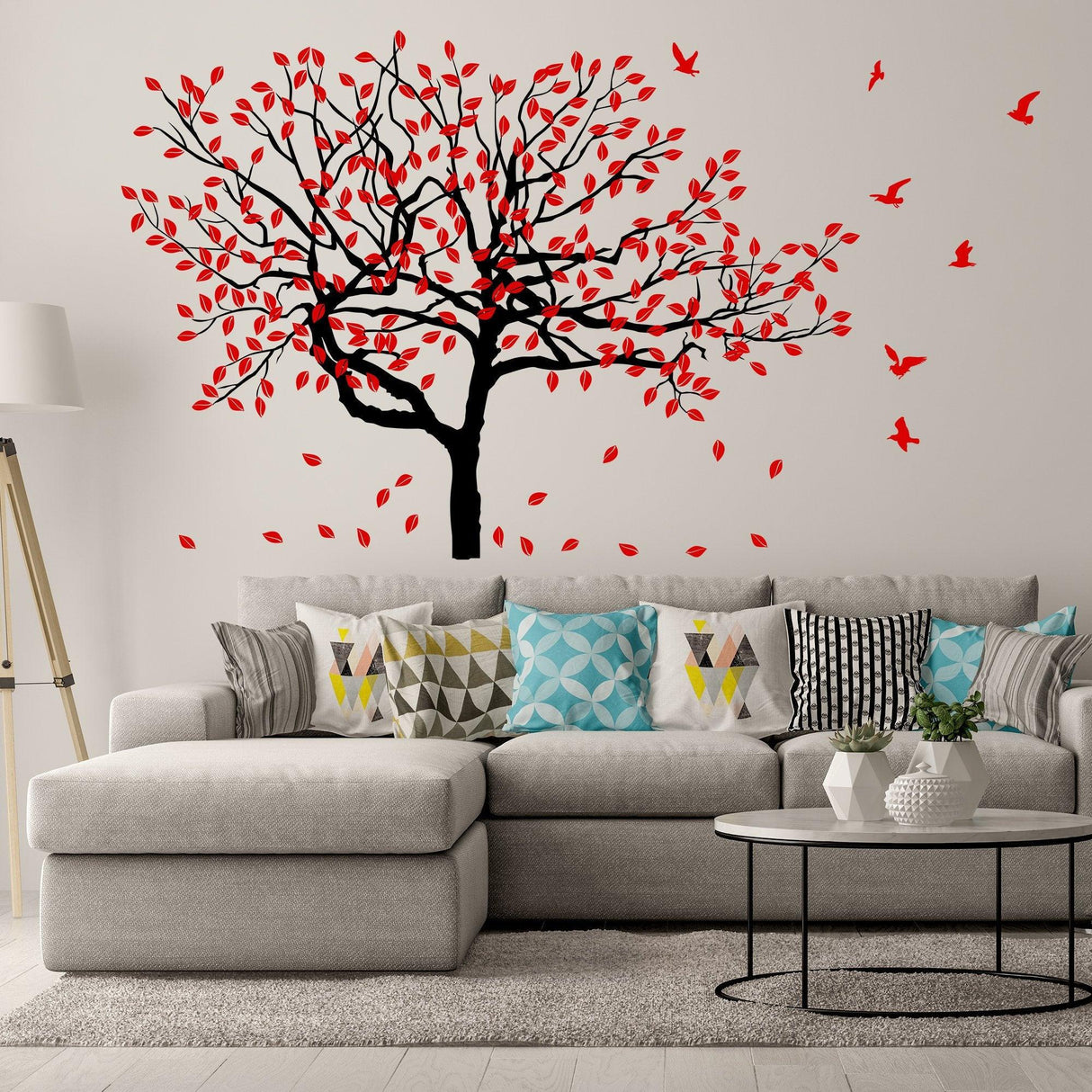 Birch tree wall decal with red leaves and birds in a stylish living room setting, enhancing interior decor.