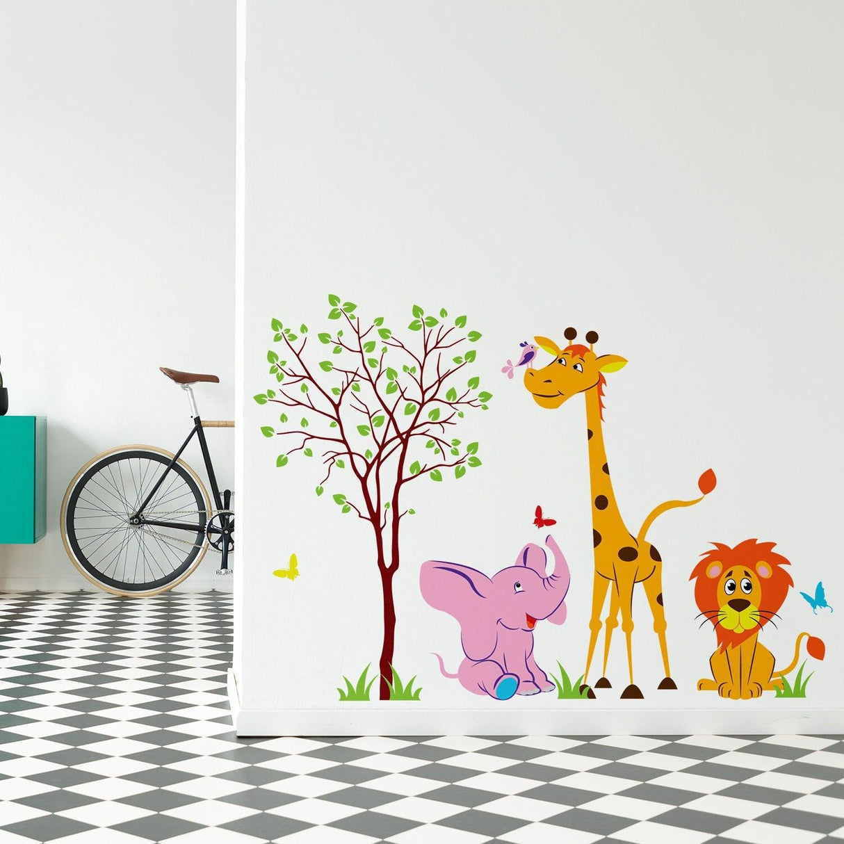 Nursery animal wall decor featuring a giraffe, elephant, lion, and tree with butterflies on a playful wall design.