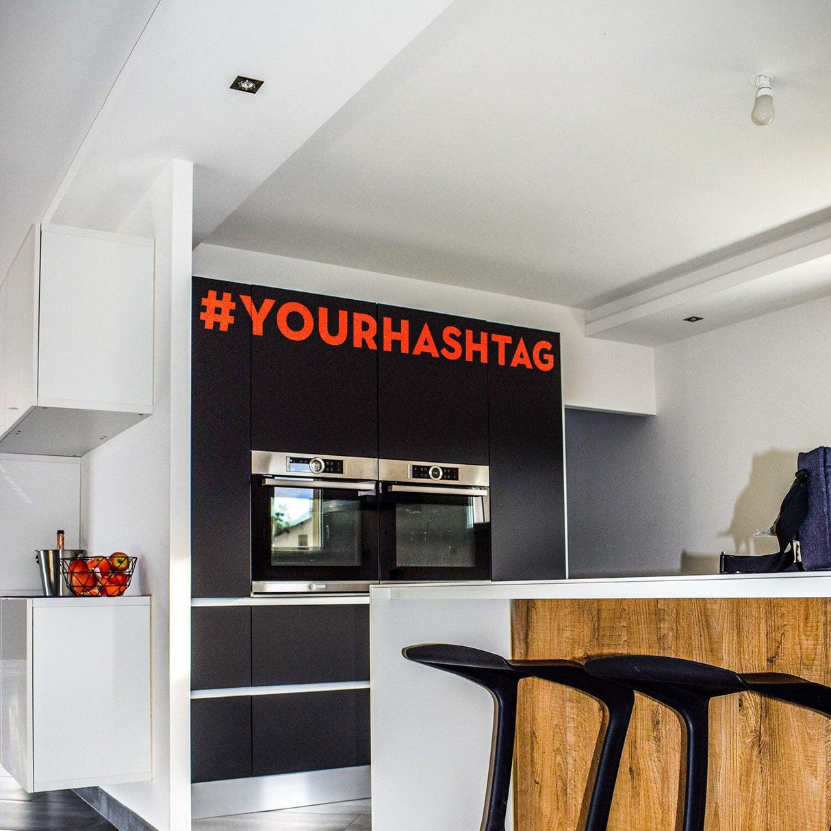 Custom hashtag vinyl sticker displayed in a modern kitchen interior with stylish decor.