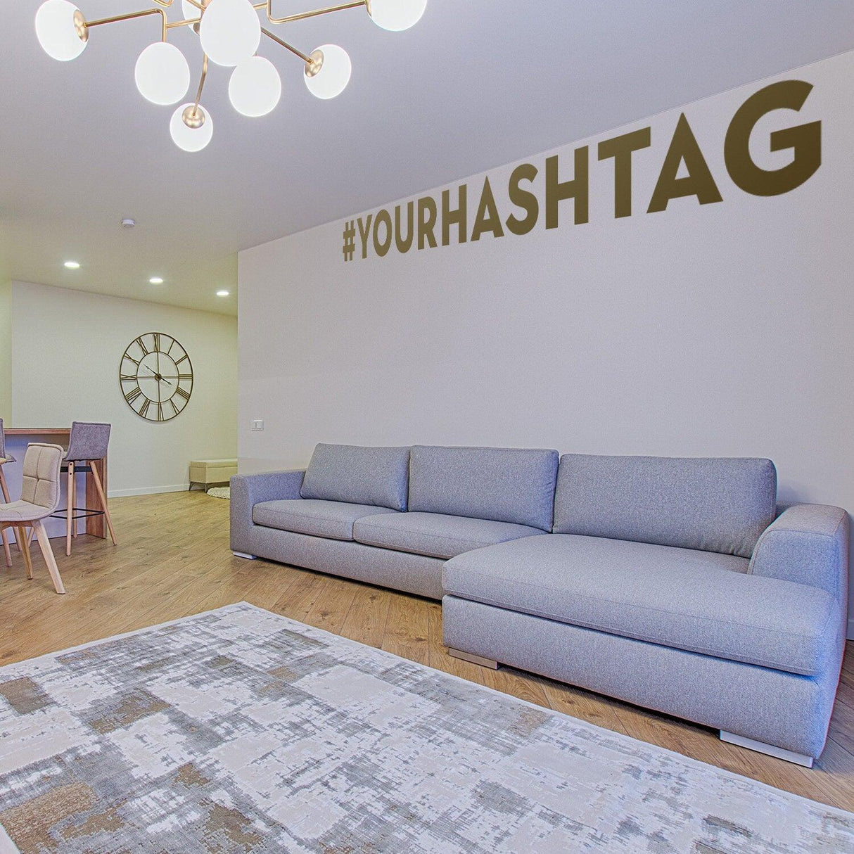 Living room featuring a wall decal of #YOURHASHTAG, showcasing a stylish social media customization element.