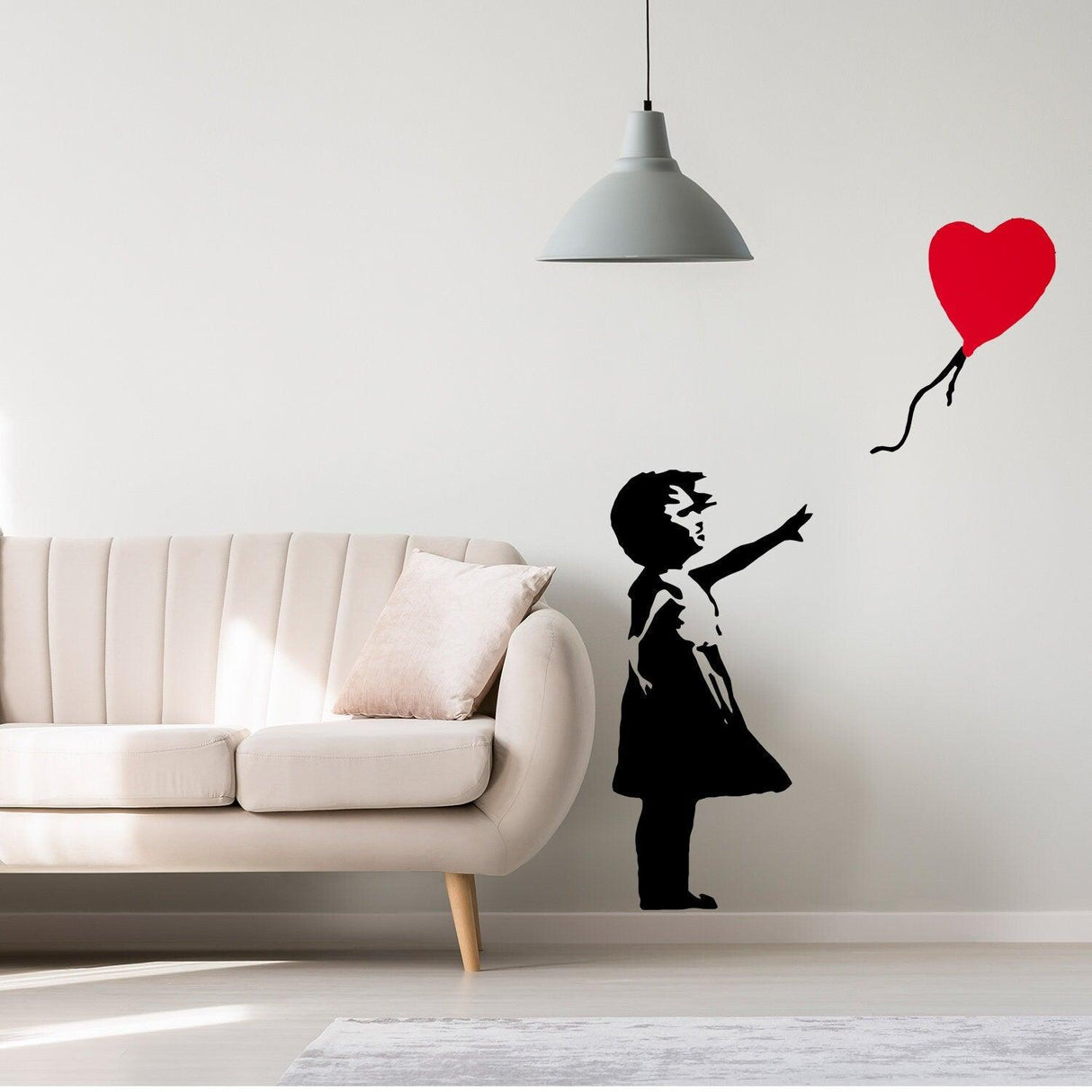 Banksy Girl With Heart Balloon wall sticker in a modern living room, adding urban style to the space.