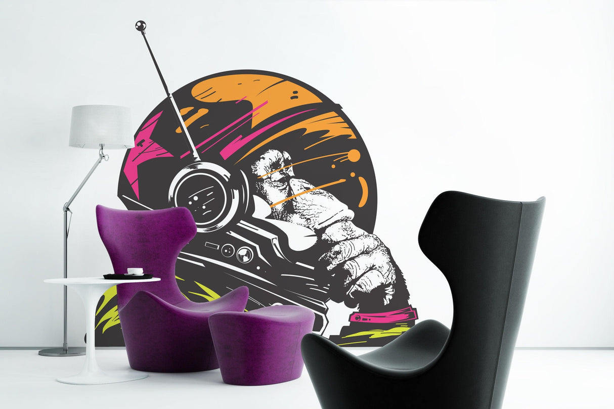 Funny astronaut space monkey wall vinyl sticker in a modern room with purple chairs and lamp.