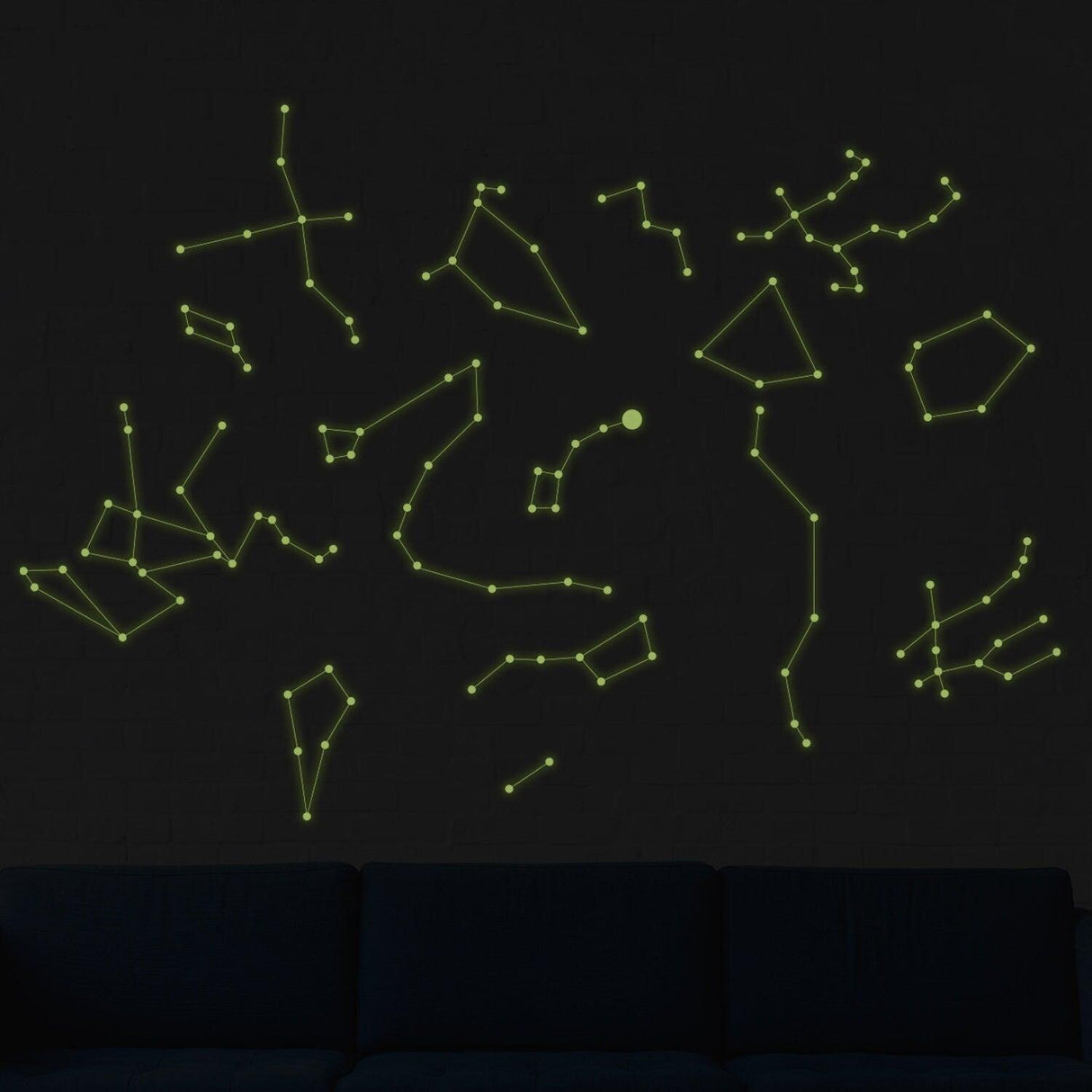 Glowing vinyl ceiling decal featuring constellations and lines against a dark wall, perfect for starry décor.