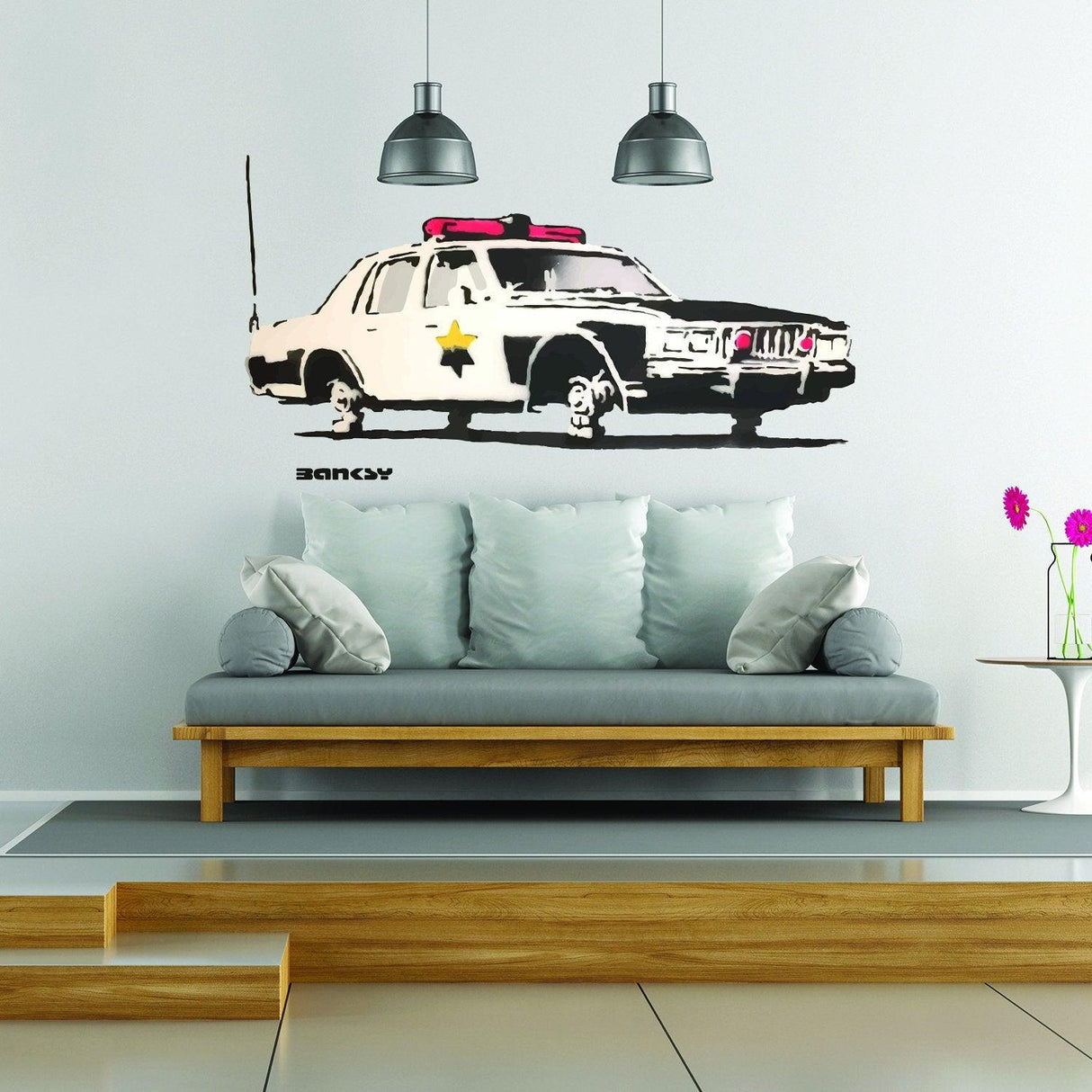Police car wall vinyl sticker mural in modern living room with stylish sofa and pendant lights.