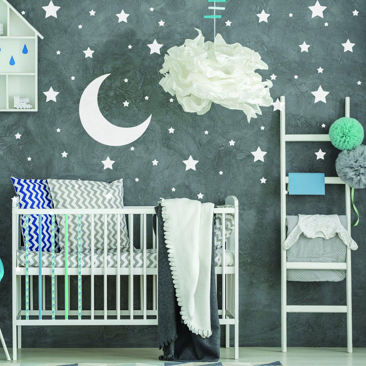 Nursery featuring 233x white stars wall vinyl stickers and moon decal on a dark wall with a crib and decorative elements.