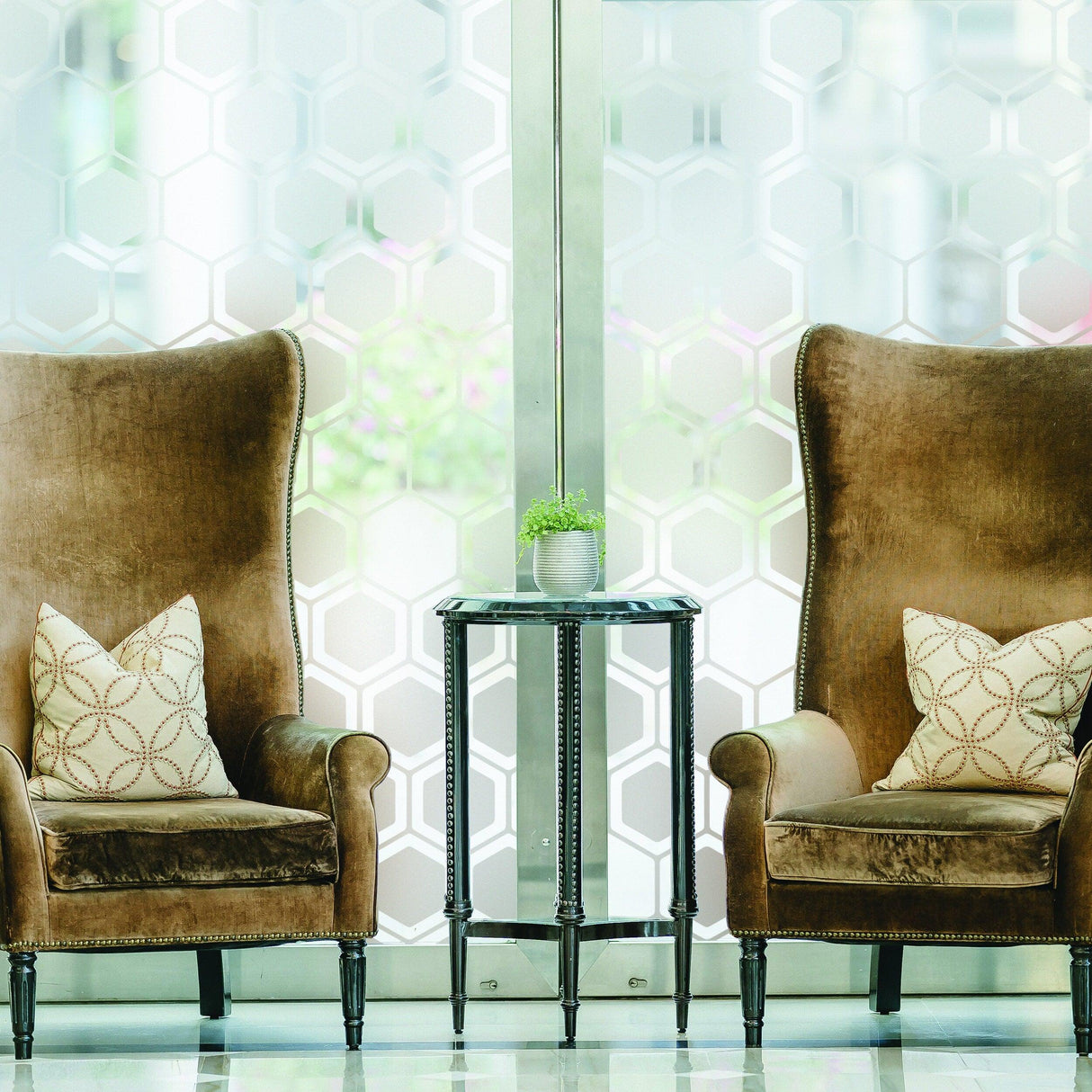 Elegant frosted window decal showcasing hexagonal design, enhancing privacy in a stylish lounge setting.