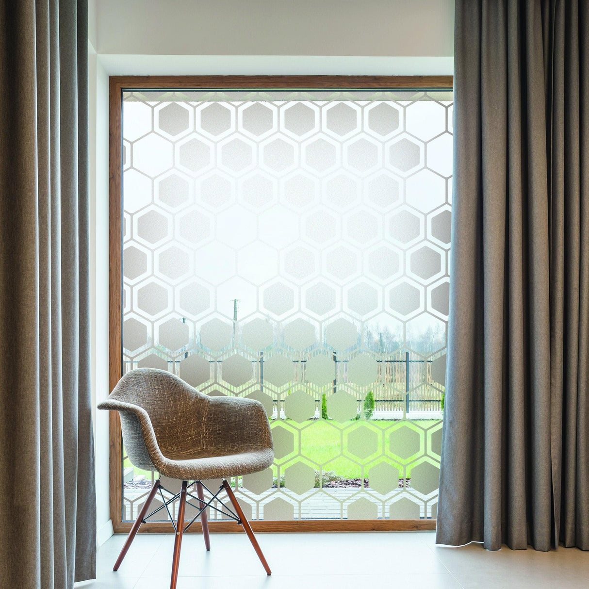 Frosted window film privacy decal with honeycomb pattern in a modern bedroom setting.