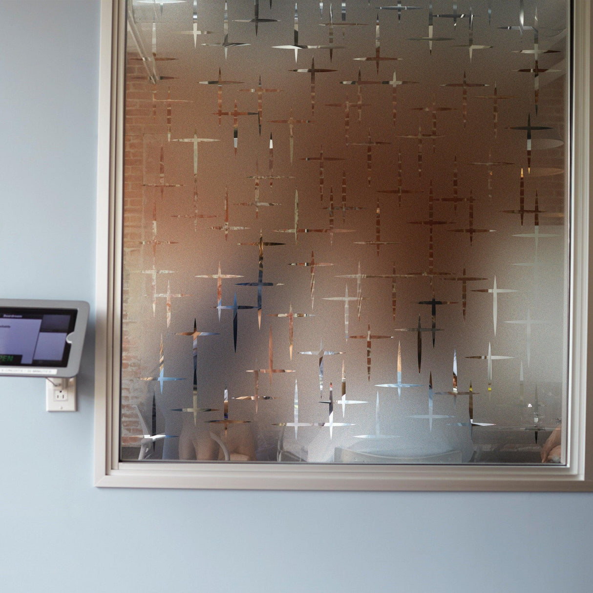 Frosted window vinyl decal creating an elegant frosted glass effect in a stylish interior.