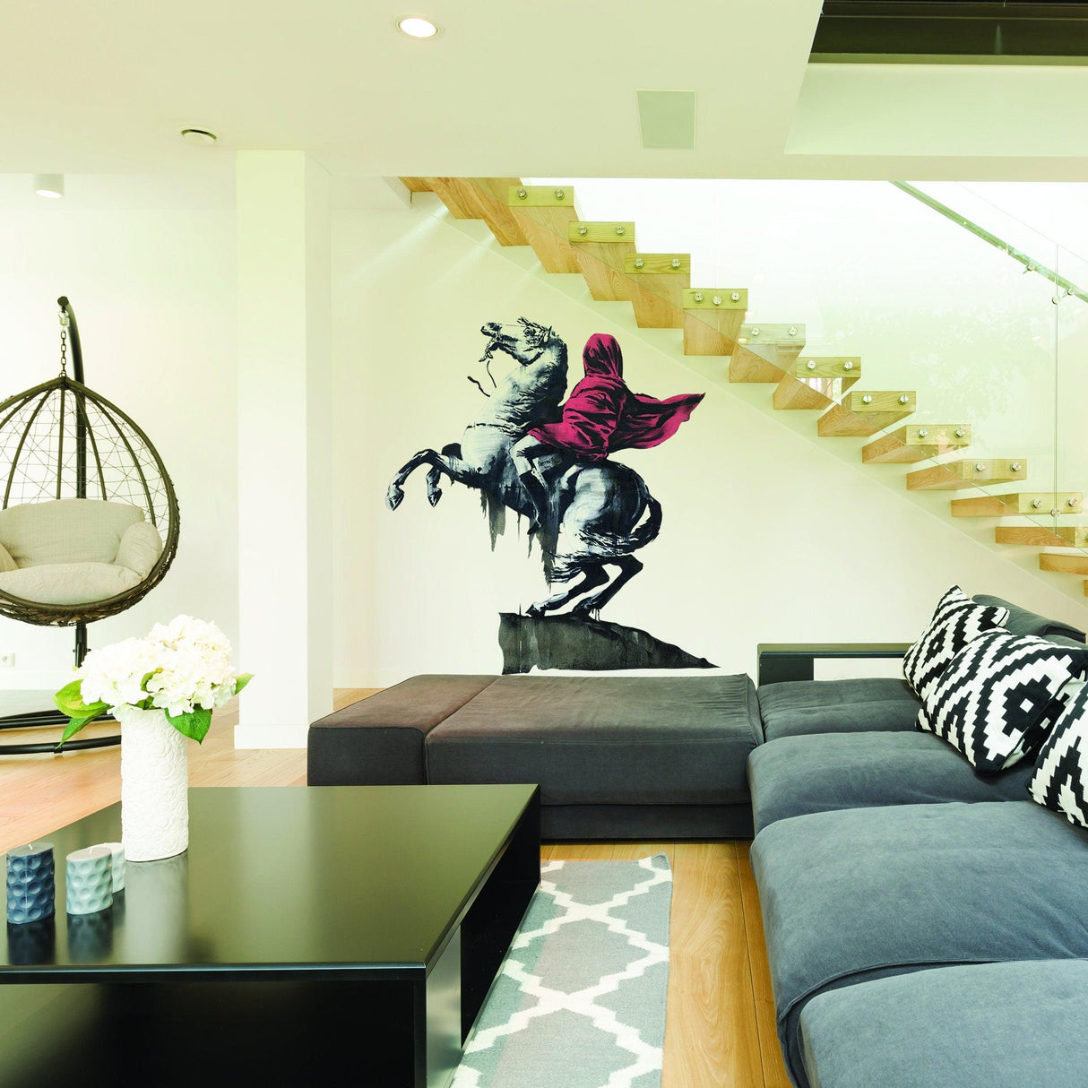 Banksy Napoleon vinyl wall sticker in modern living room, adding urban style to home decor.