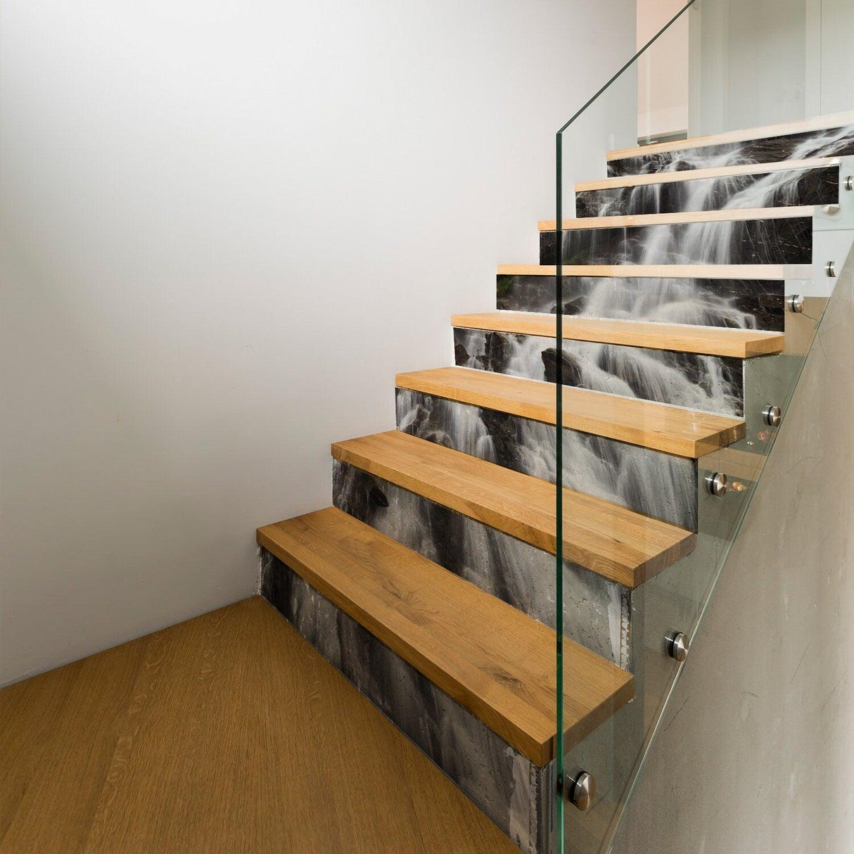 Stylish staircase featuring wooden steps and decorative vinyl riser decals for a modern look.