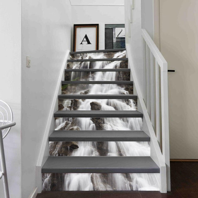 Stair riser vinyl decals featuring a waterfall design, enhancing the aesthetics of a modern staircase.