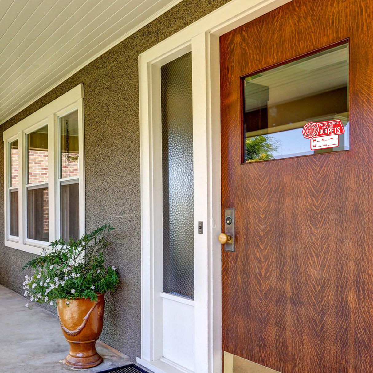Front door featuring a pet alert emergency cling sticker to inform responders of pets inside.