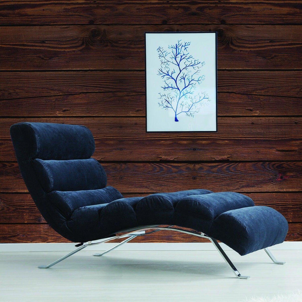 Stylish lounge chair against a rustic wood wall, showcasing a blue tree art piece, enhancing cozy home decor.