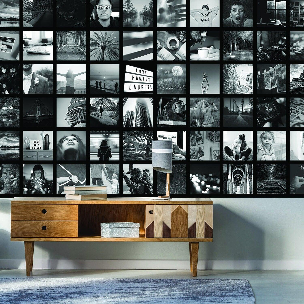 Stylish black and white photo collage wallpaper sticker on a living room wall with a modern wooden cabinet.