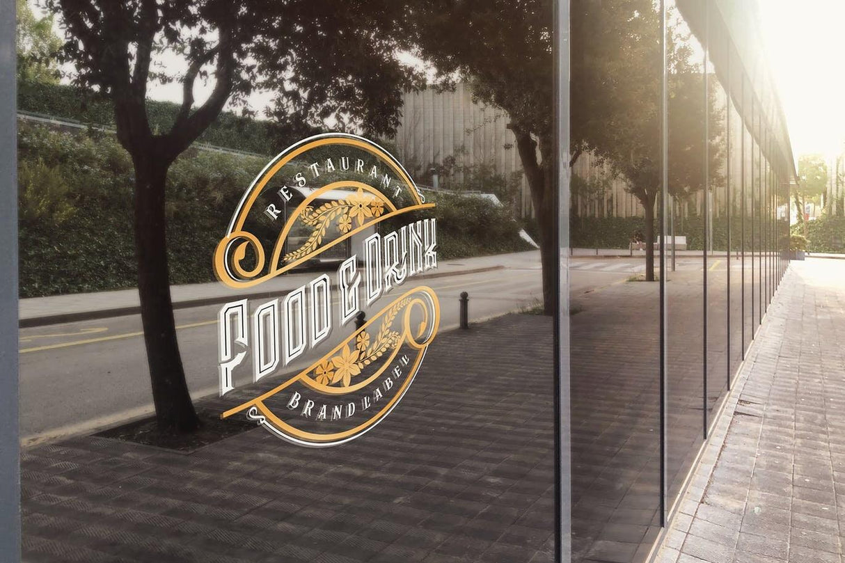 Custom static cling vinyl sticker on restaurant window displaying 'Food & Drink' branding.