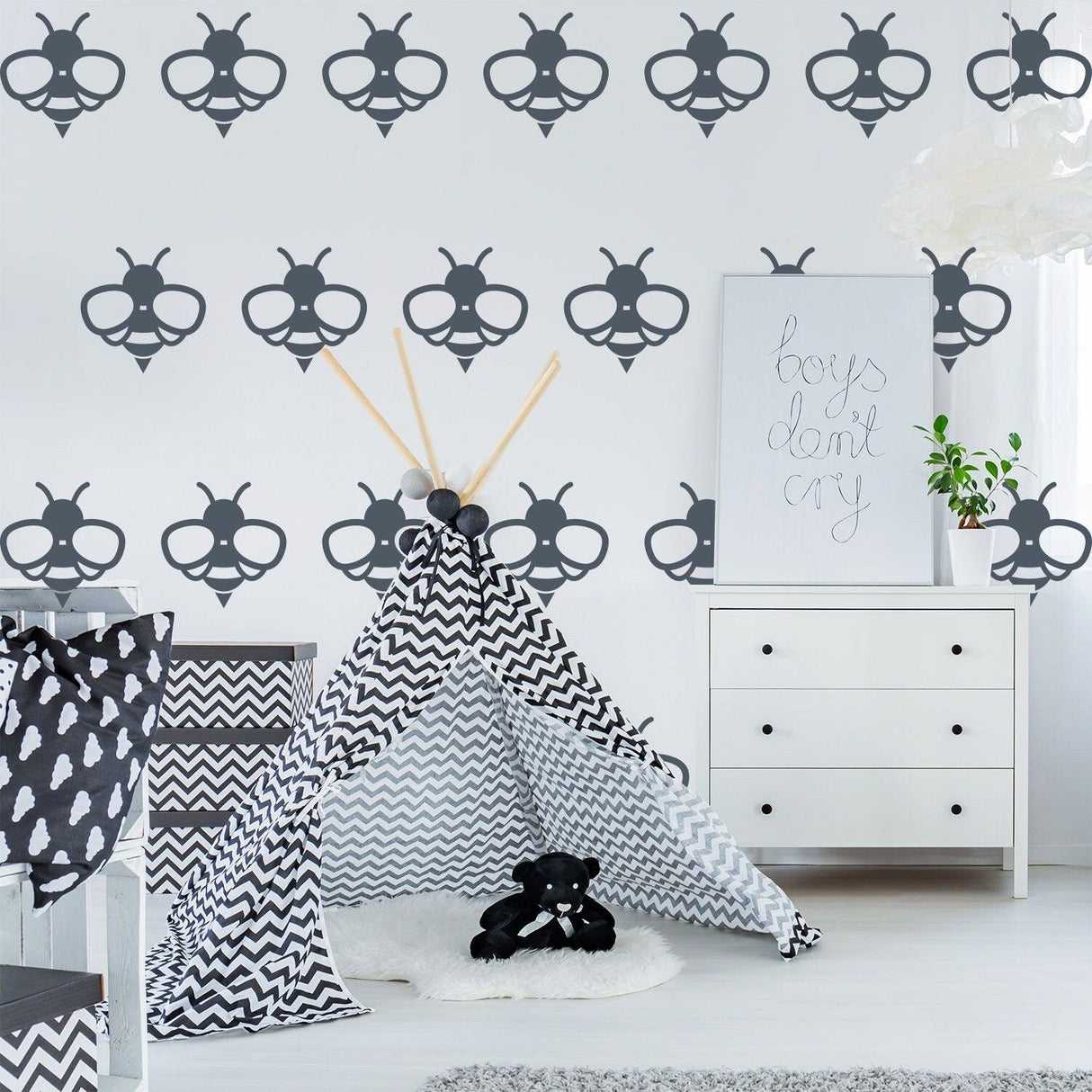 Stylish nursery featuring 40x bee wall stickers and a cozy play tent in black and white decor.