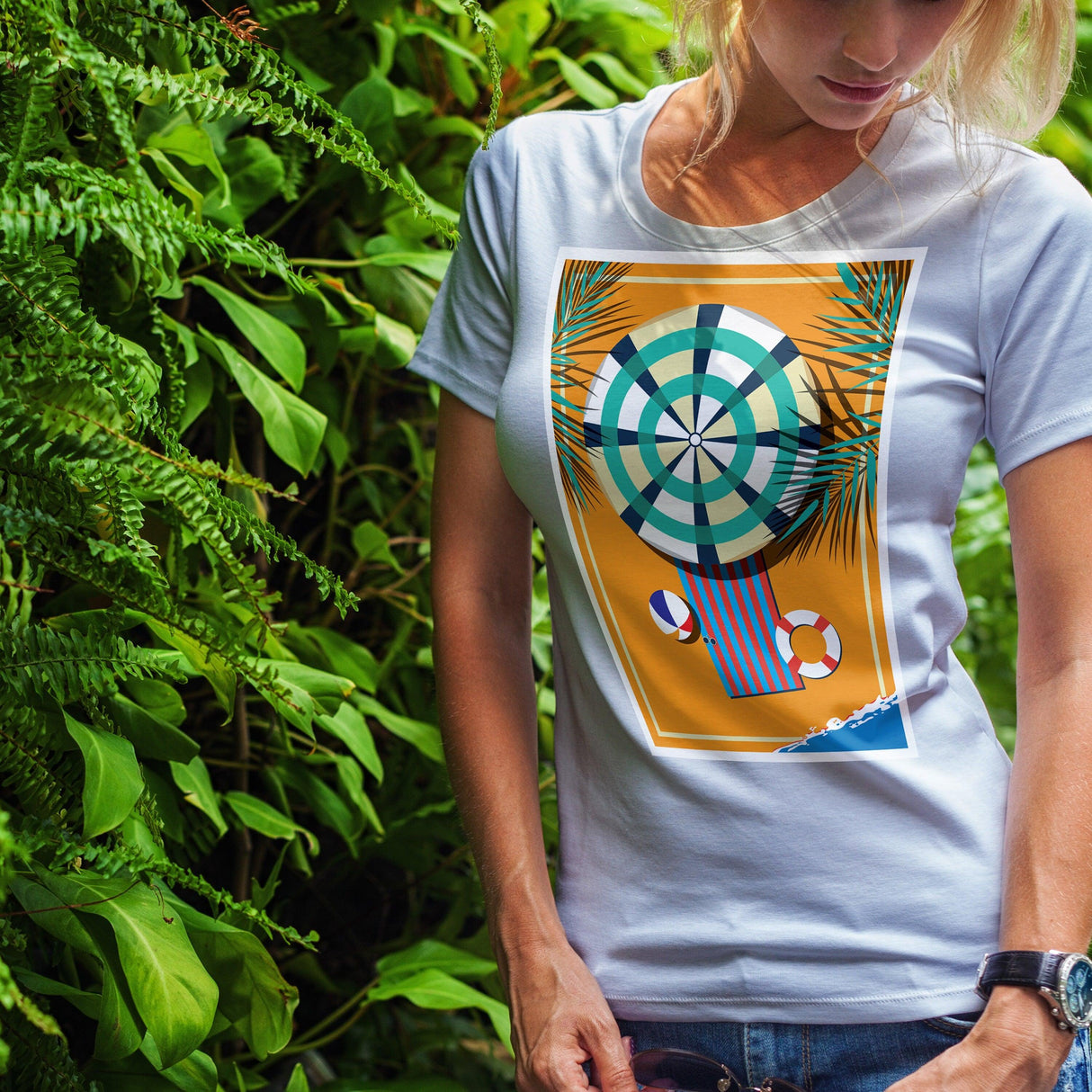 Custom design t-shirt featuring a vibrant beach theme with palm leaves and colorful summer accessories.