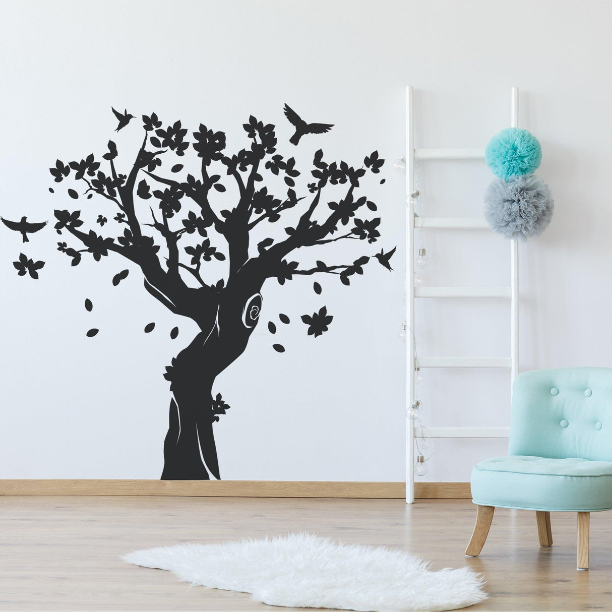 Tree wall decal decor in black, featuring intricate branches and flowers, perfect for nursery or kids room.