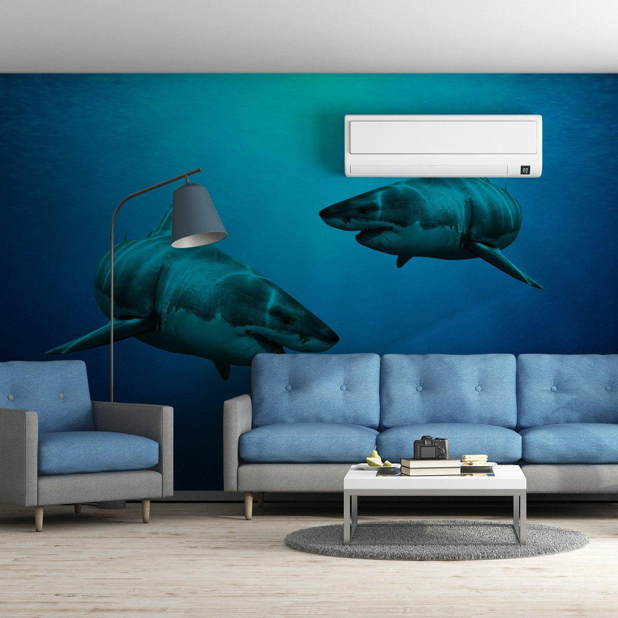 3D wallpaper shark decor sticker in living room with blue sofa, creating an underwater ocean theme.