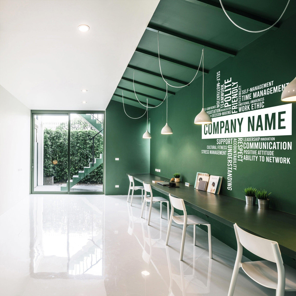 Modern office featuring a custom business name vinyl wall sticker on a green wall, designed for workspace decor.