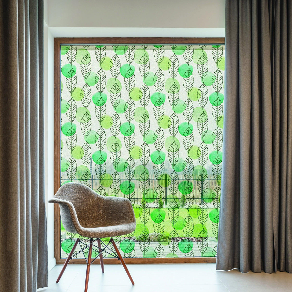 Leaf Window Privacy Glass Film with intricate leaf design, offering elegance and privacy in a modern room setting.
