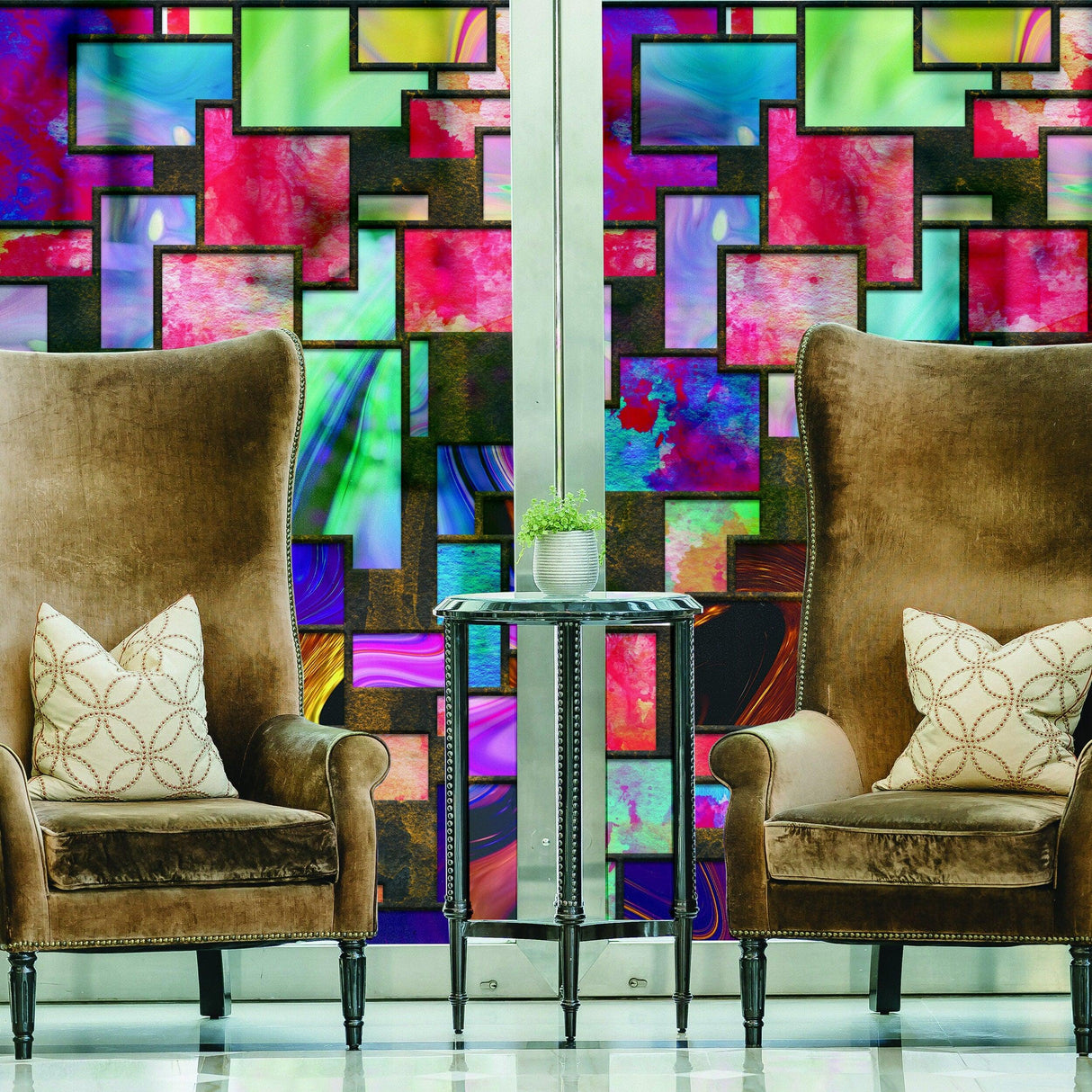 Stylish living room featuring colorful decorative window film with armchairs and a side table.