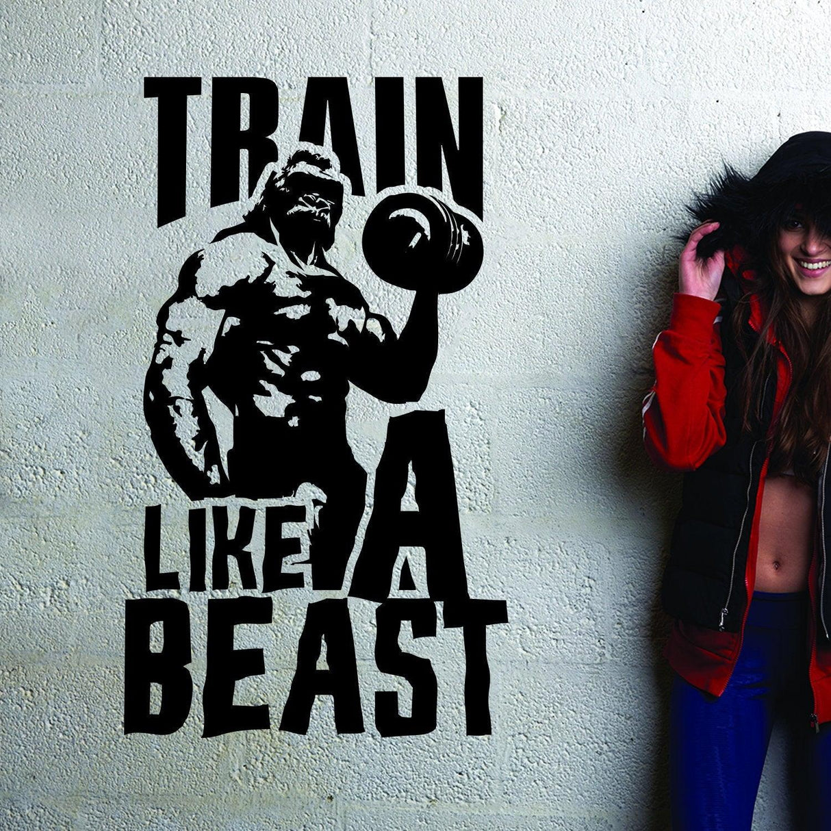 Vinyl decal featuring the quote 'Train Like A Beast' with a muscular figure, perfect for gym decor.