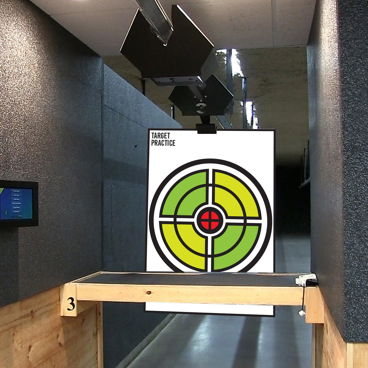 Indoor shooting range setup with a colorful target for practice with gun, rifle, pistol, and airsoft.