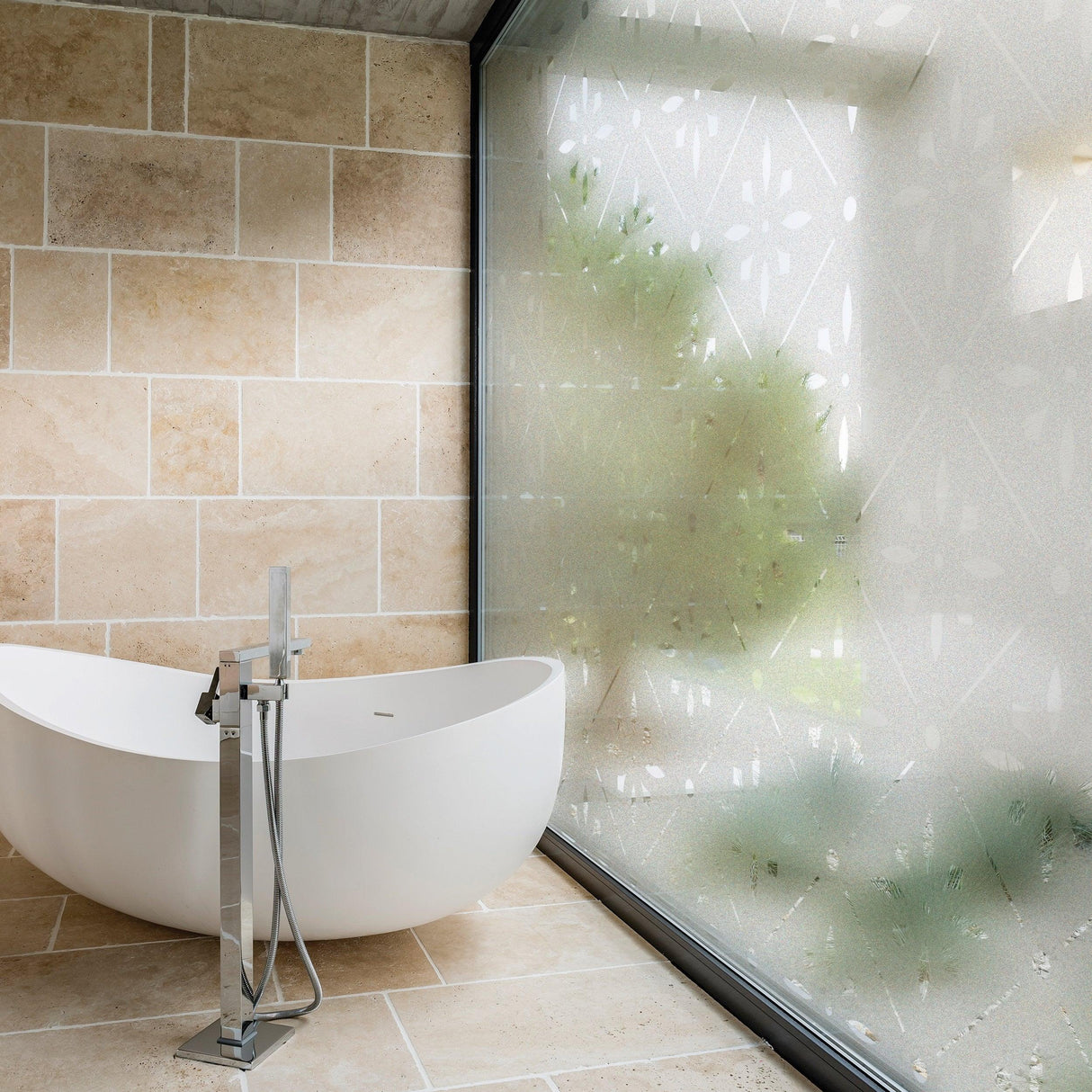 Elegant bathroom featuring a frosted window decal for privacy and style.