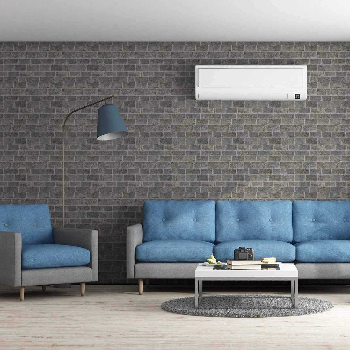 Modern living room featuring 3D effect brick self-adhesive wallpaper with blue sofas and a stylish lamp.