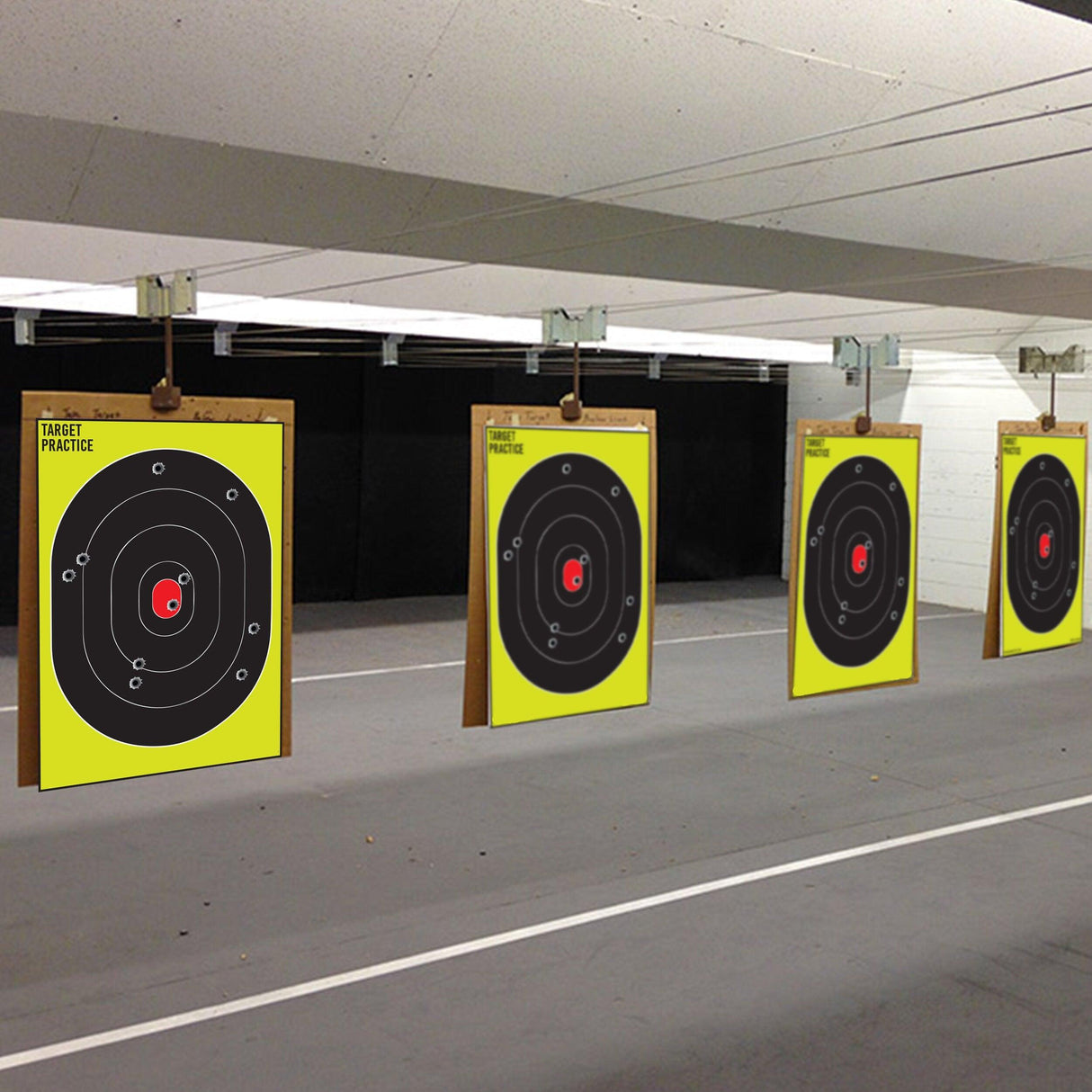 Large outdoor shooting targets for practice with black circles on bright yellow paper, designed for various firearms.