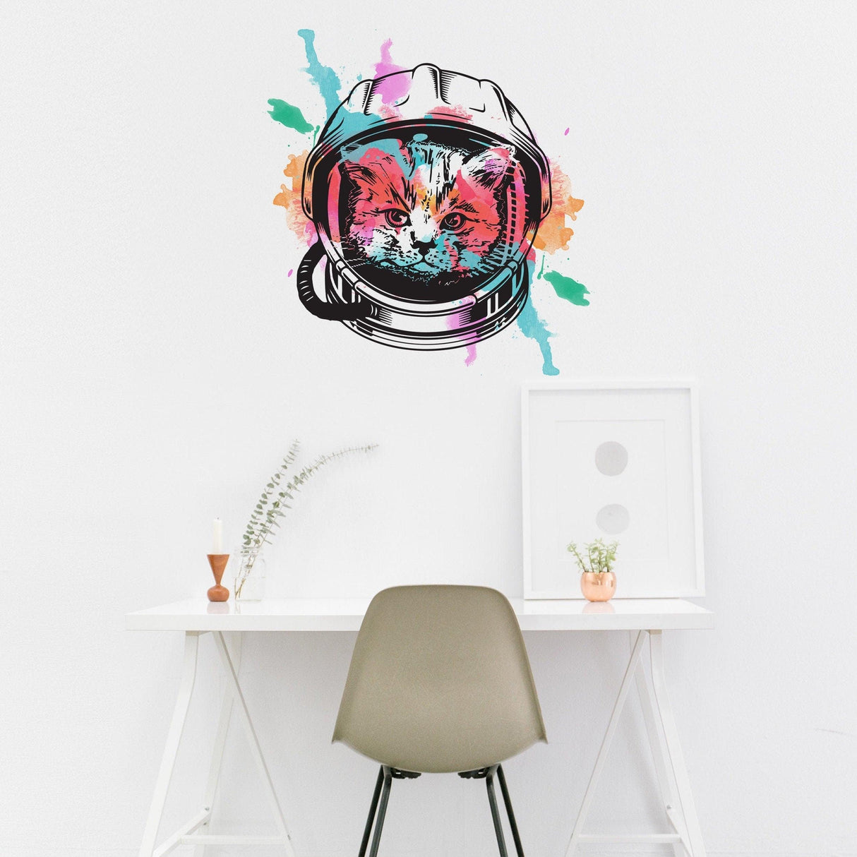 Whimsical Space Cat Wall Art Sticker featuring a colorful astronaut kitten in a helmet on a white wall.