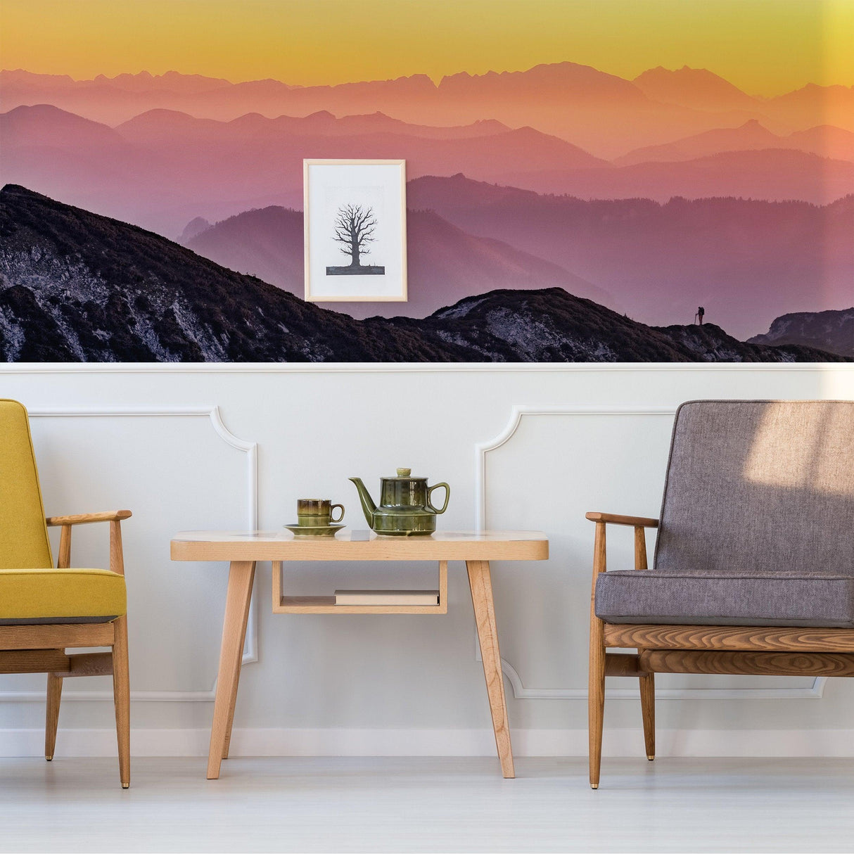 Serene sunset wallpaper mural in a modern living room with stylish chairs and a decorative table.