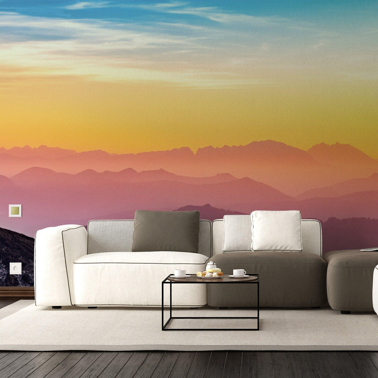Modern living room with sunset wallpaper decals in warm hues and cozy furniture.