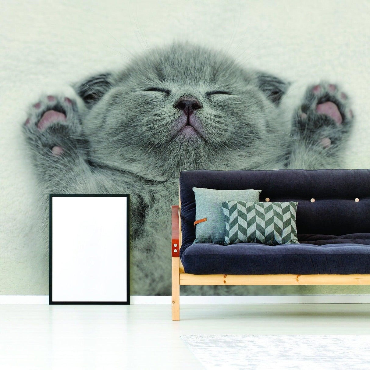 Gray kitten wall art decal above modern couch in a cozy home setting, perfect for cat lovers.
