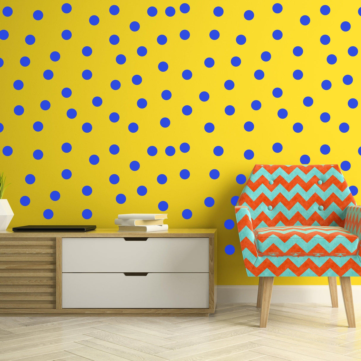 Colorful blue circle wall stickers on a bright yellow wall with a patterned chair and modern furniture.
