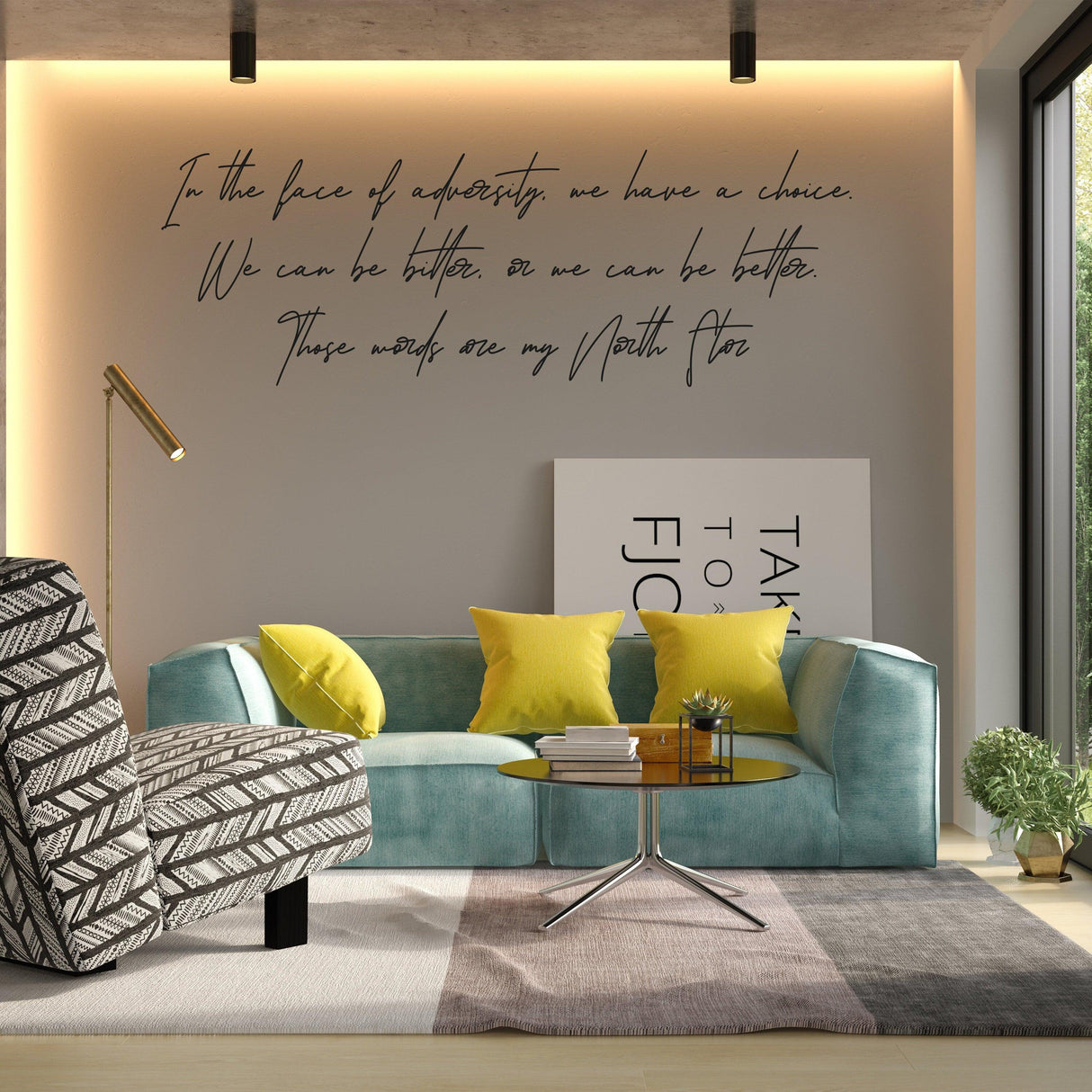 Inspirational vinyl quote sticker on a modern living room wall with turquoise couch and yellow cushions.