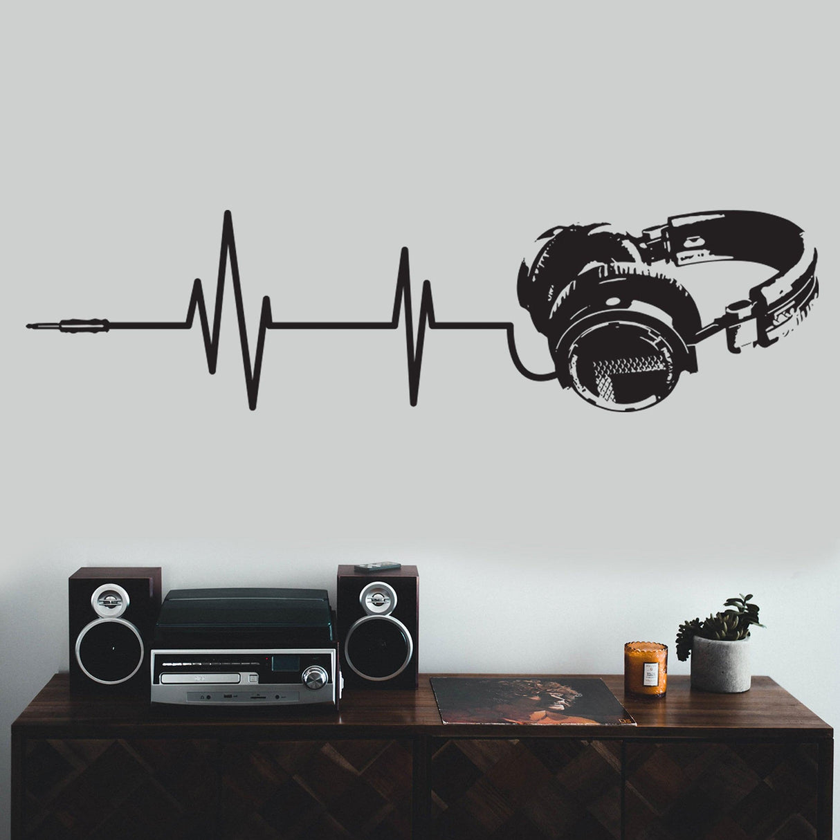 Music wall decal featuring headphones and sound waves, perfect for teen boys' room decor.