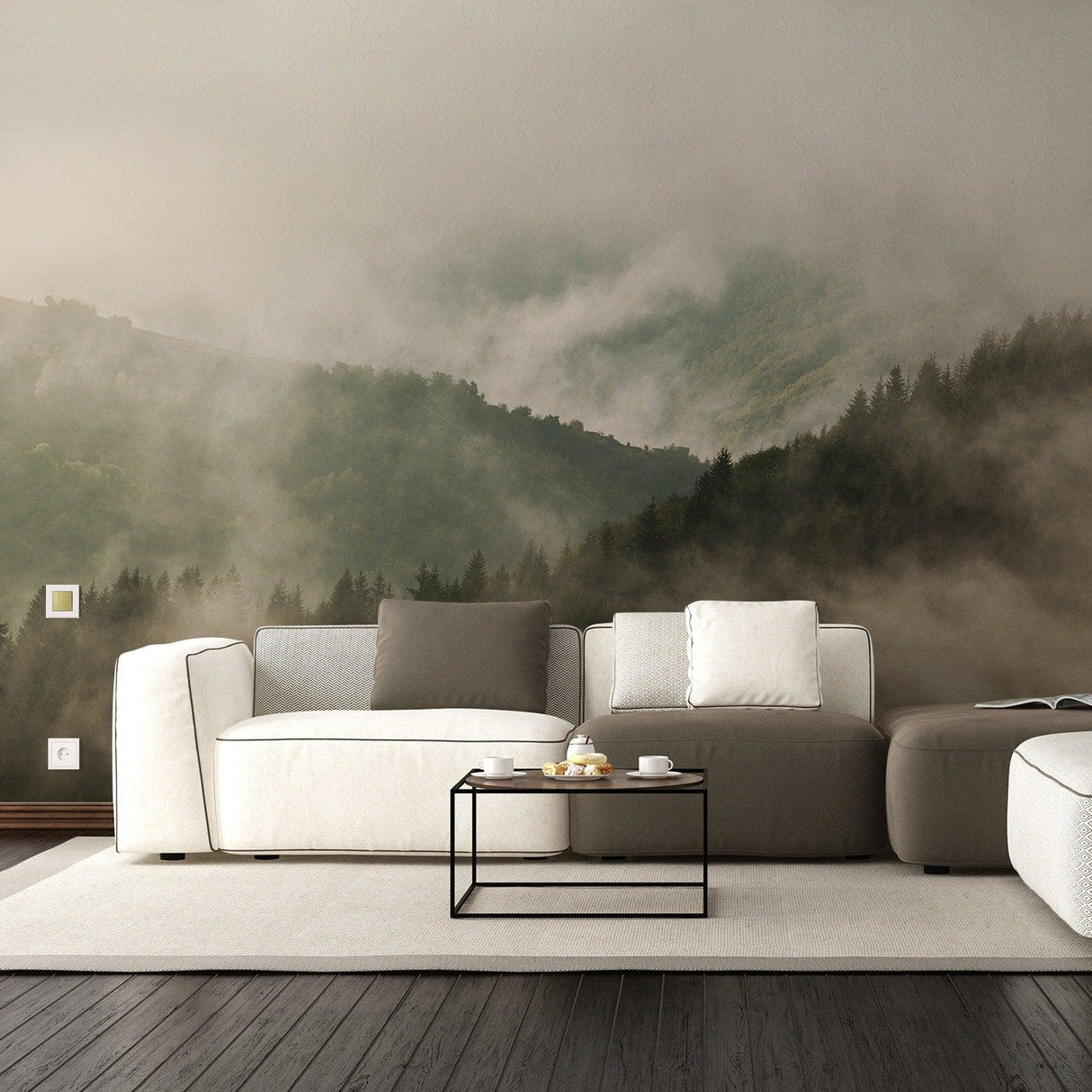 Foggy forest wallpaper mural displayed in a modern living room with white furniture and a coffee table.