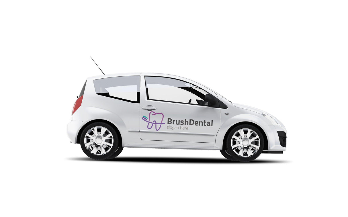 White car with 'BrushDental' vinyl decal on the side, showcasing personalized vehicle branding.