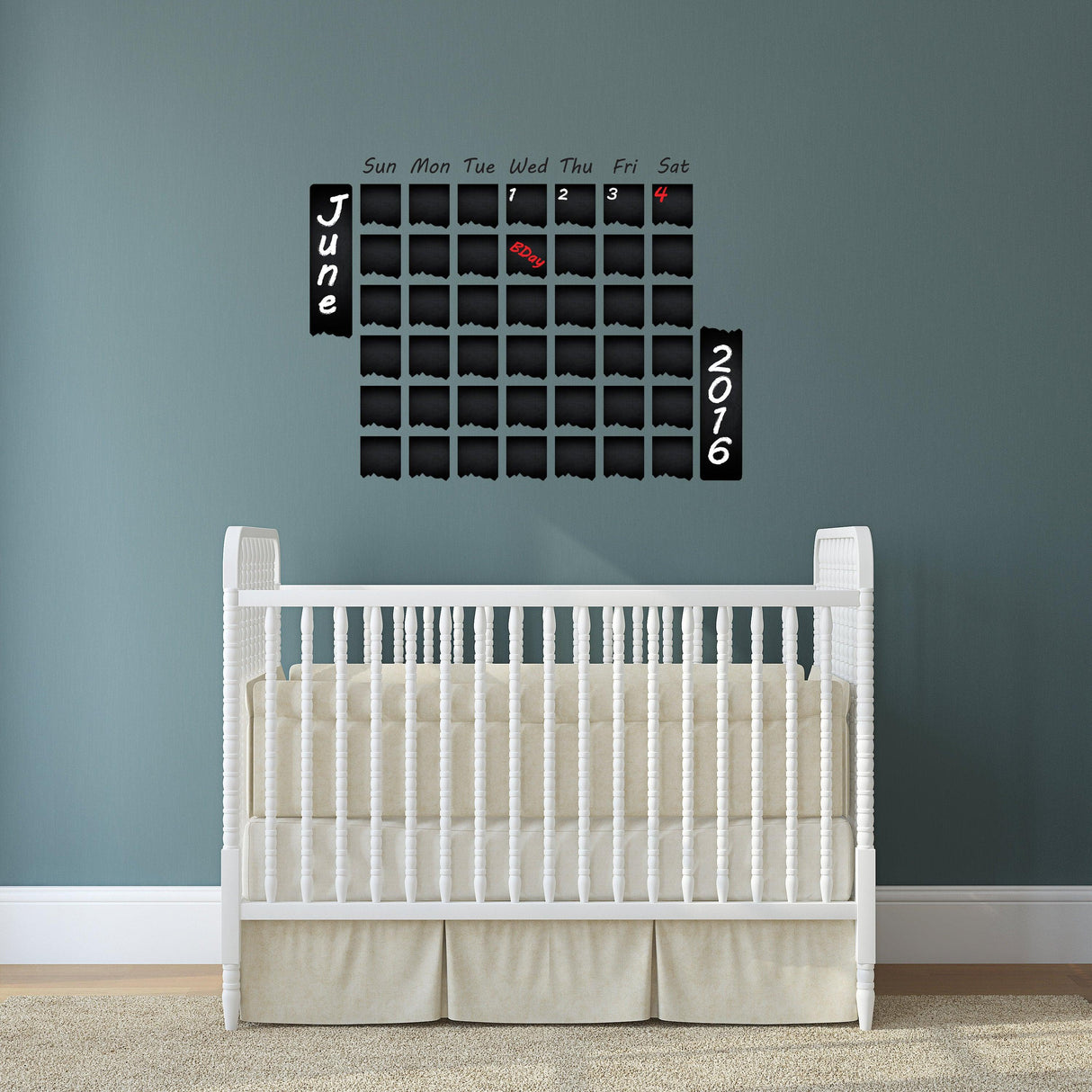 Weekly planner chalkboard wall sticker for organized scheduling above a crib in a stylish nursery.