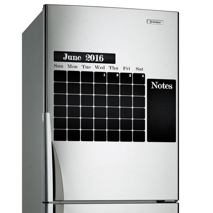 Chalkboard wall planner sticker on stainless steel fridge for organizing monthly schedule and notes.