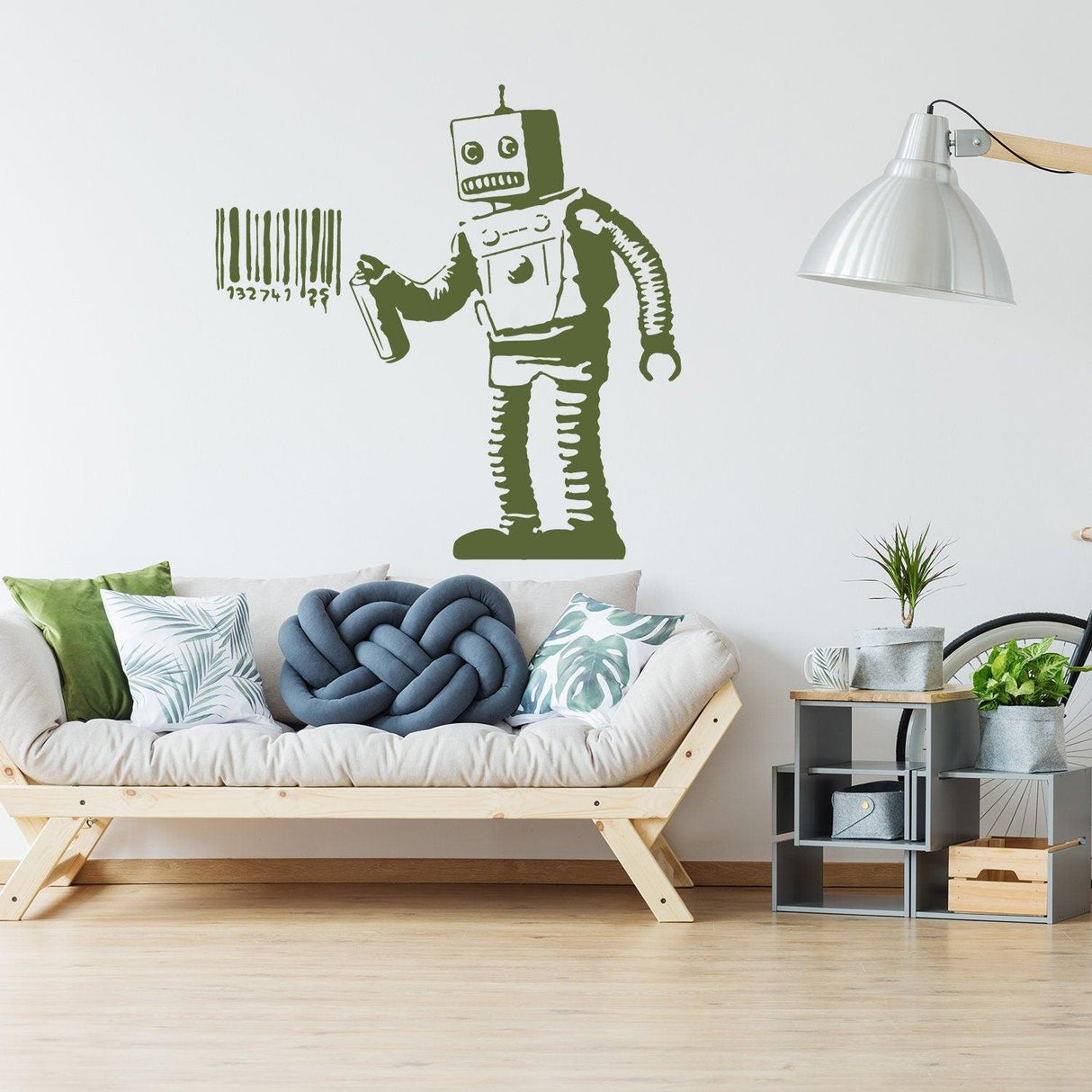 Banksy Barcode Robot Wall Vinyl Sticker on a white wall above a modern sofa, showcasing unique street art decor.
