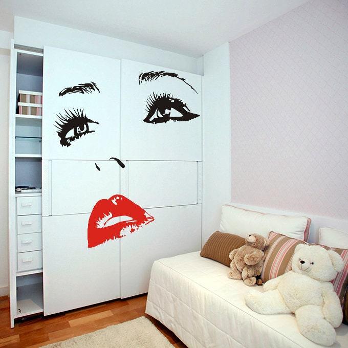 Elegant bedroom decor featuring woman eyes and red lips wall sticker on white cabinets.