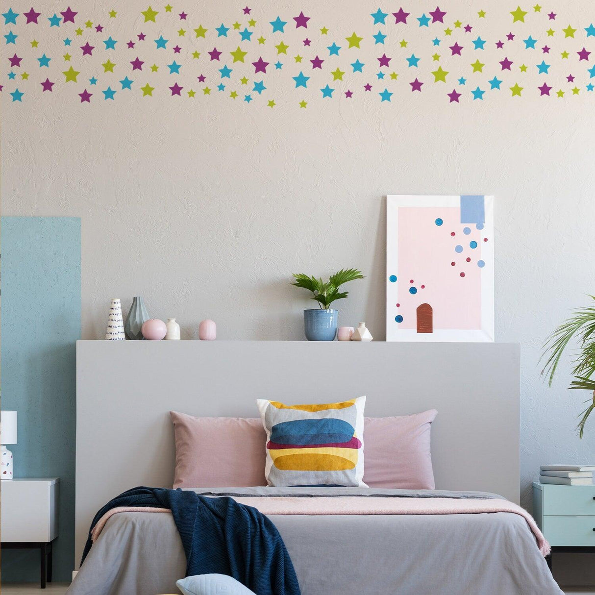 Colorful wall decals of stars in a nursery, adding charm and personality to the child's bedroom decor.