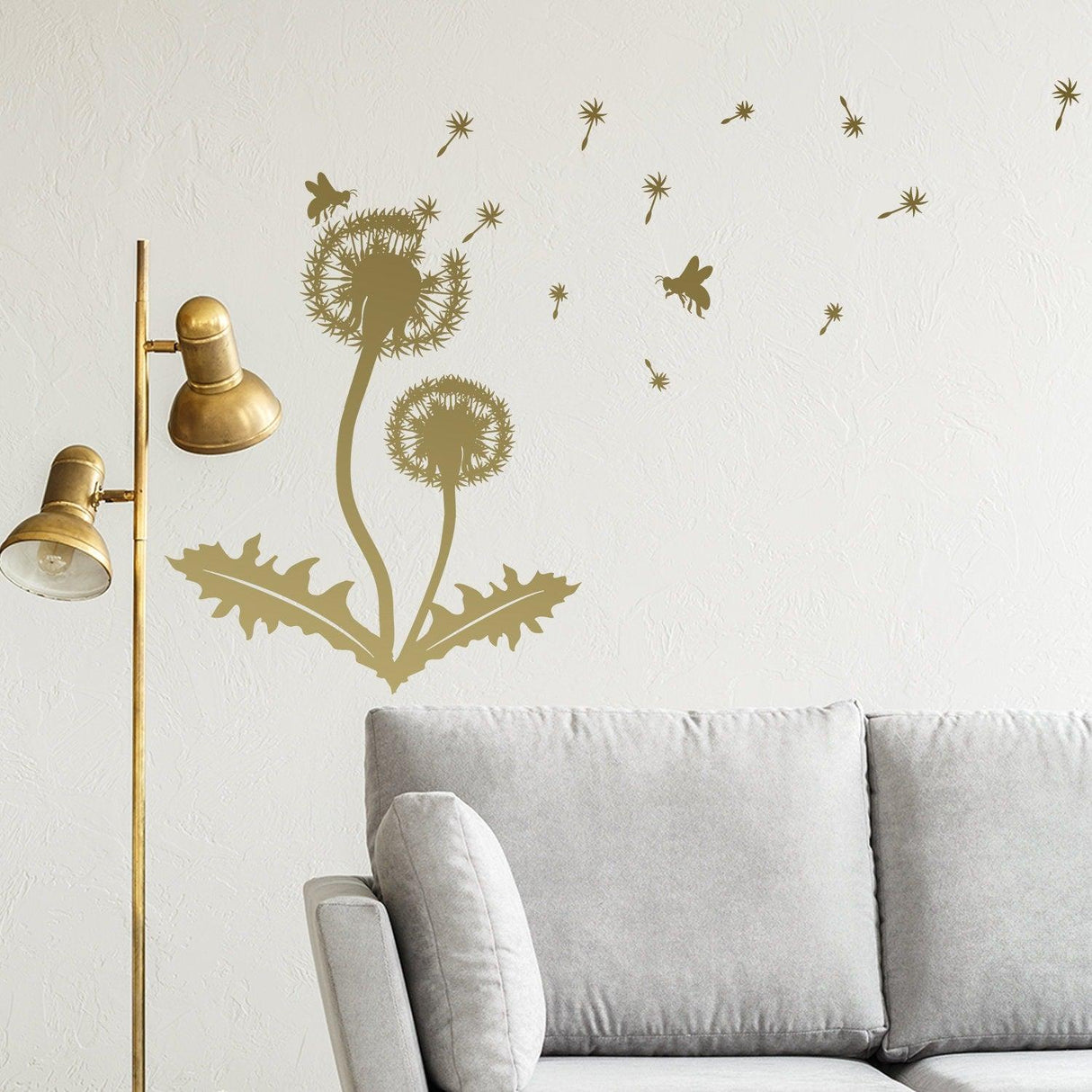Dandelion wall decor decal in gold vinyl, enhancing a cozy living space with whimsy and nature.