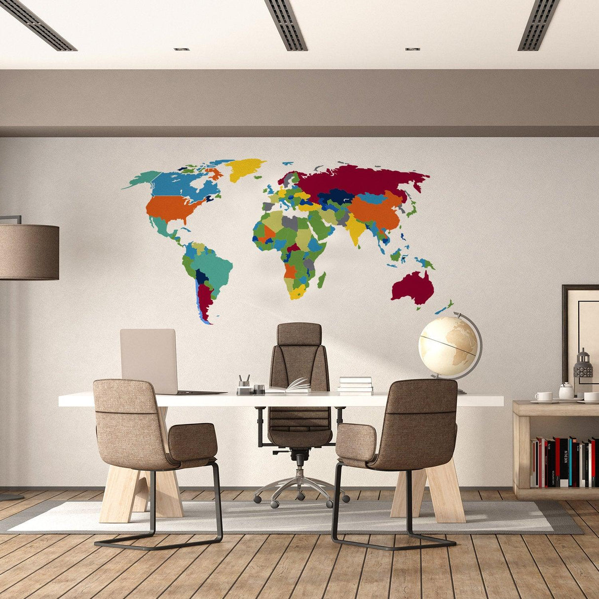Colorful world map wall decal in a modern office setting with stylish furniture and a globe.