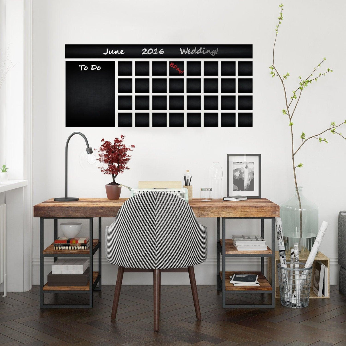 Chalkboard wall planner in modern workspace, featuring a weekly calendar for organization and meal planning.
