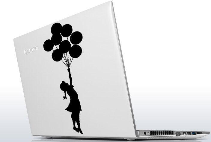 Banksy girl with balloons laptop decal on Lenovo laptop showcasing street art design.